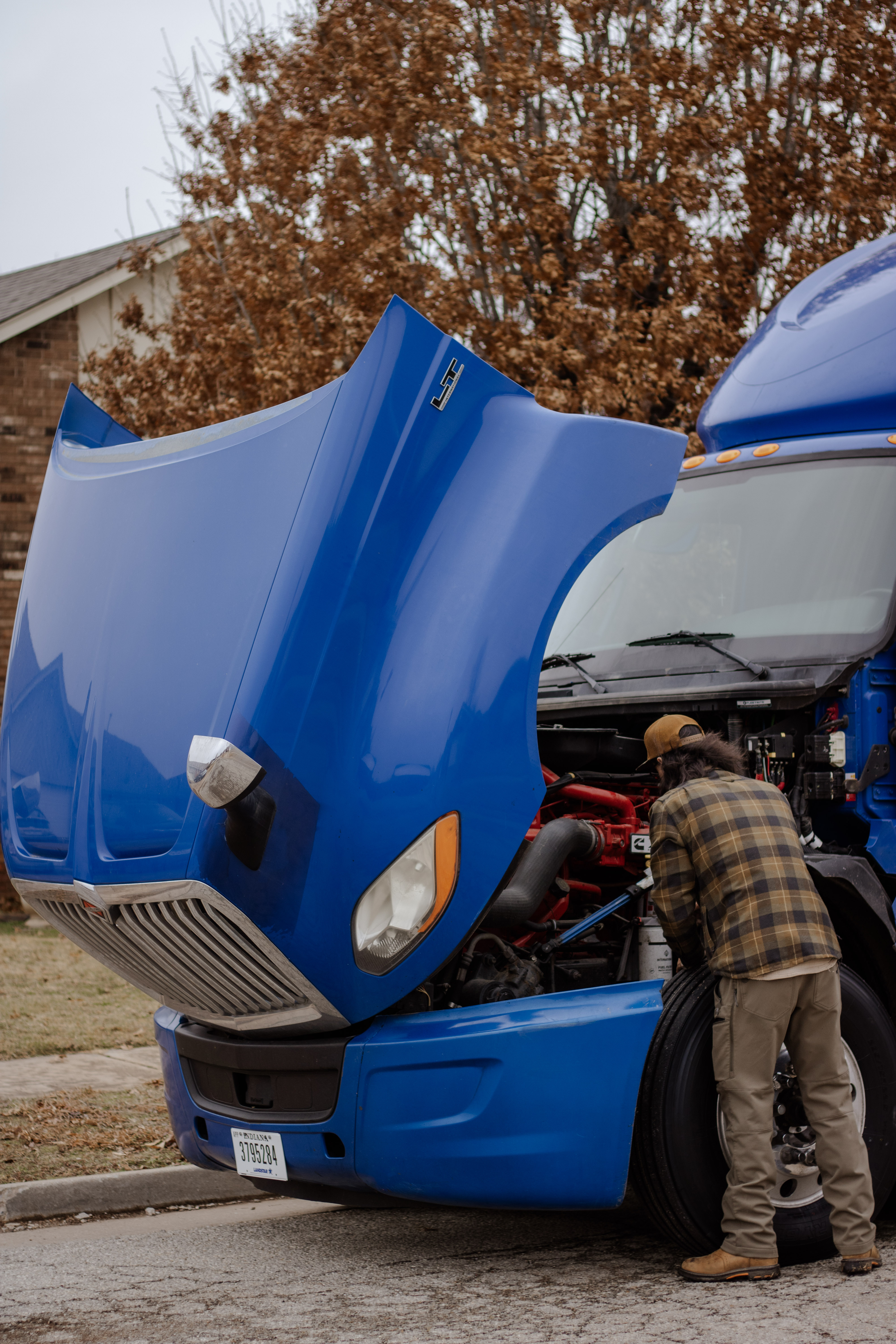 Blue truck hood open during service